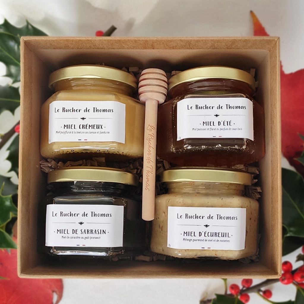 Pots de miel personnalisés présentés dans un coffret cadeau d'entreprise
